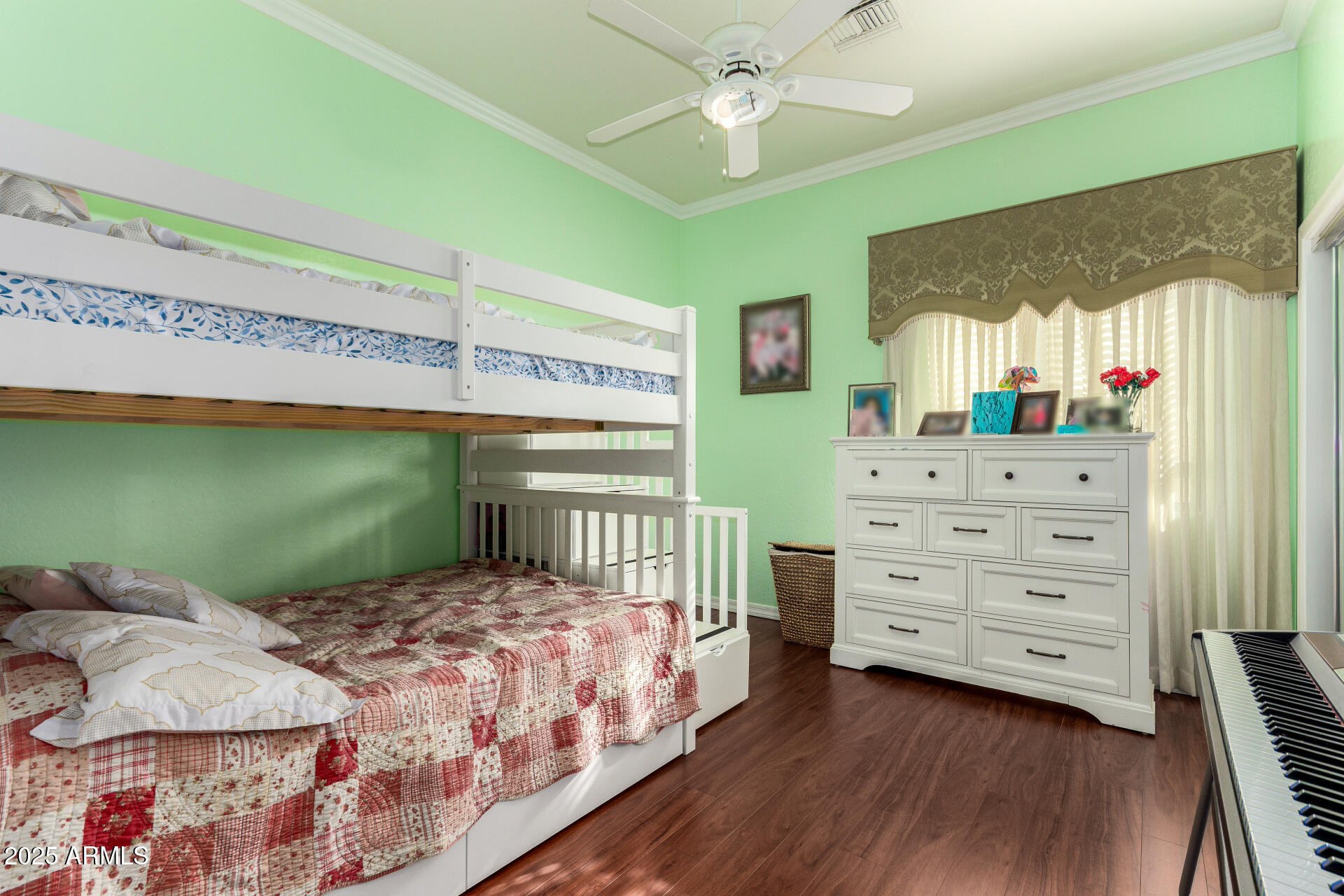 8912 North 15th Lane Phoenix, AZ 85021 - Photo 24 of 33 a bedroom with a bed a window and dresser
