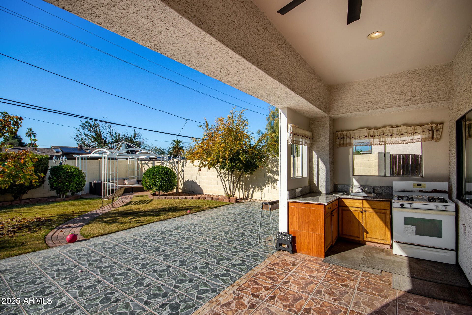 8912 North 15th Lane Phoenix, AZ 85021 - Photo 29 of 33 a view of a swimming pool with chairs in front of a house