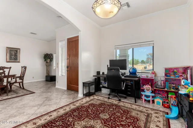 a view of a livingroom with furniture and a flat screen tv