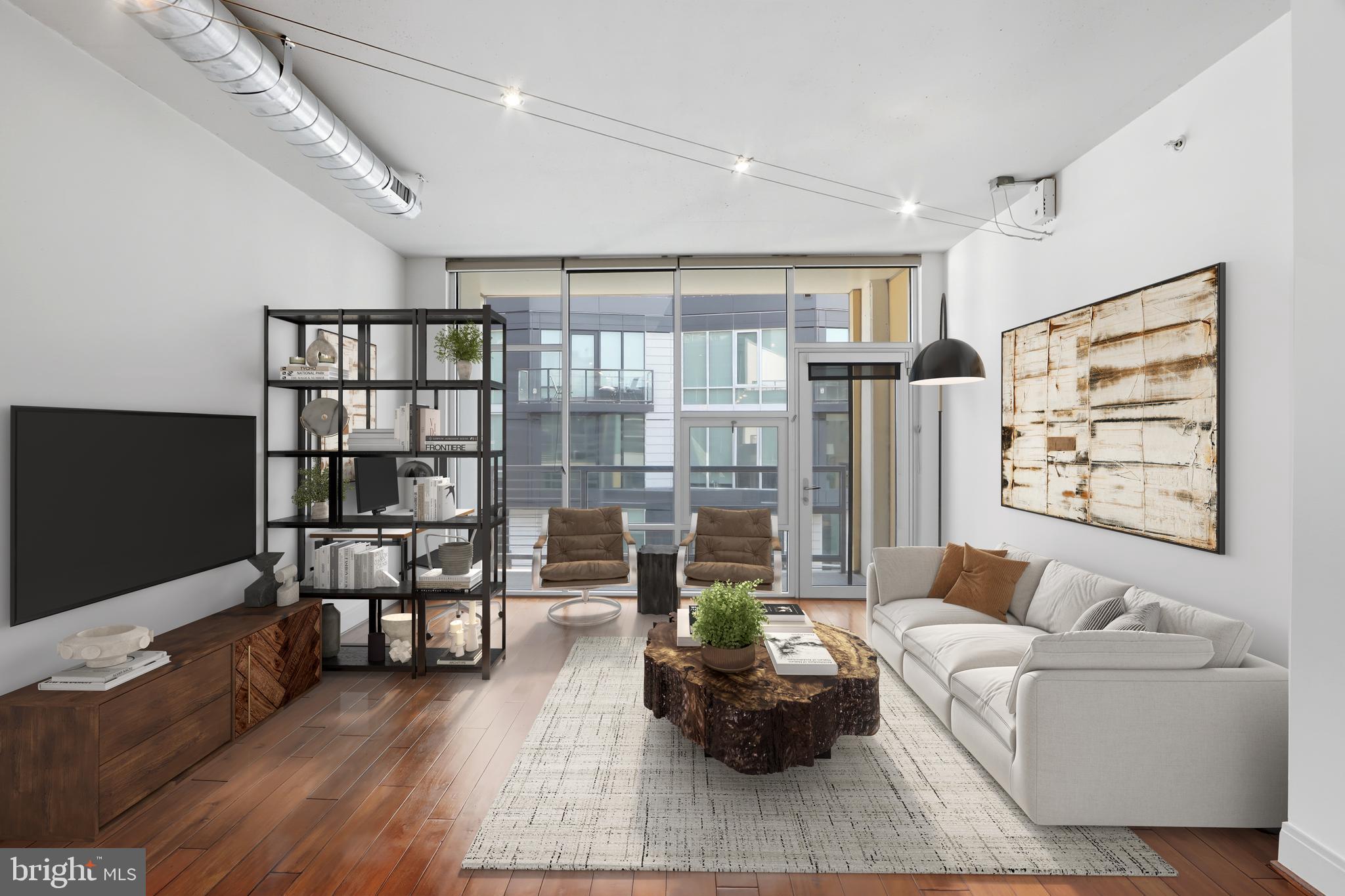 929 Florida Avenue Northwest, Unit 8001 Washington, DC 20001 - Photo 2 of 15 a living room with furniture a rug and a flat screen tv