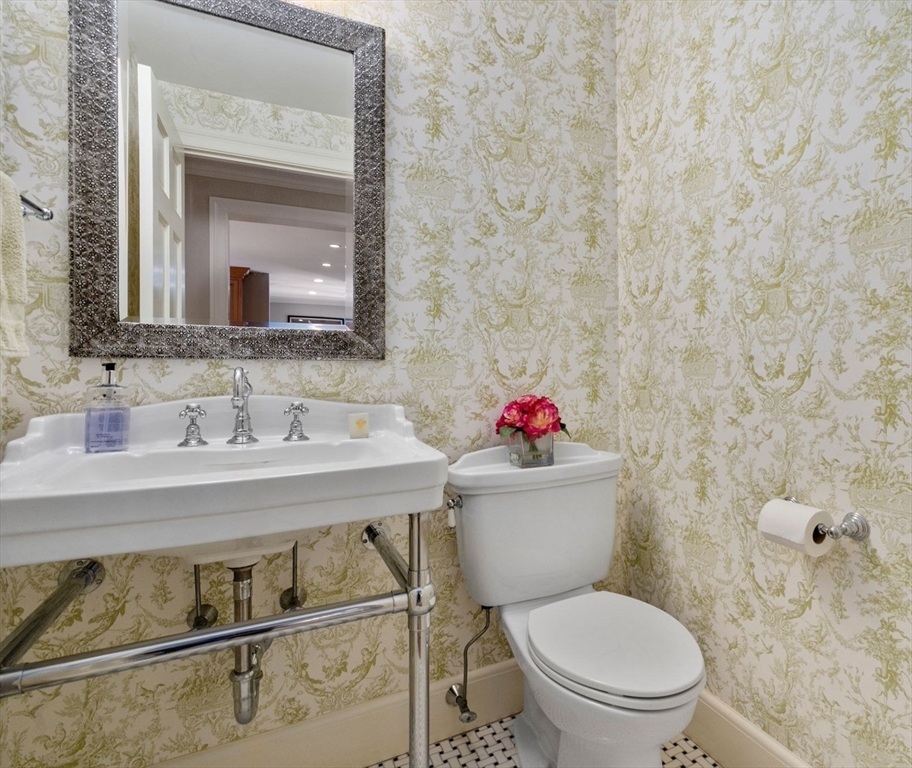30 Park Avenue Wellesley, MA 02481 - Photo 15 of 36 a bathroom with a toilet sink and mirror