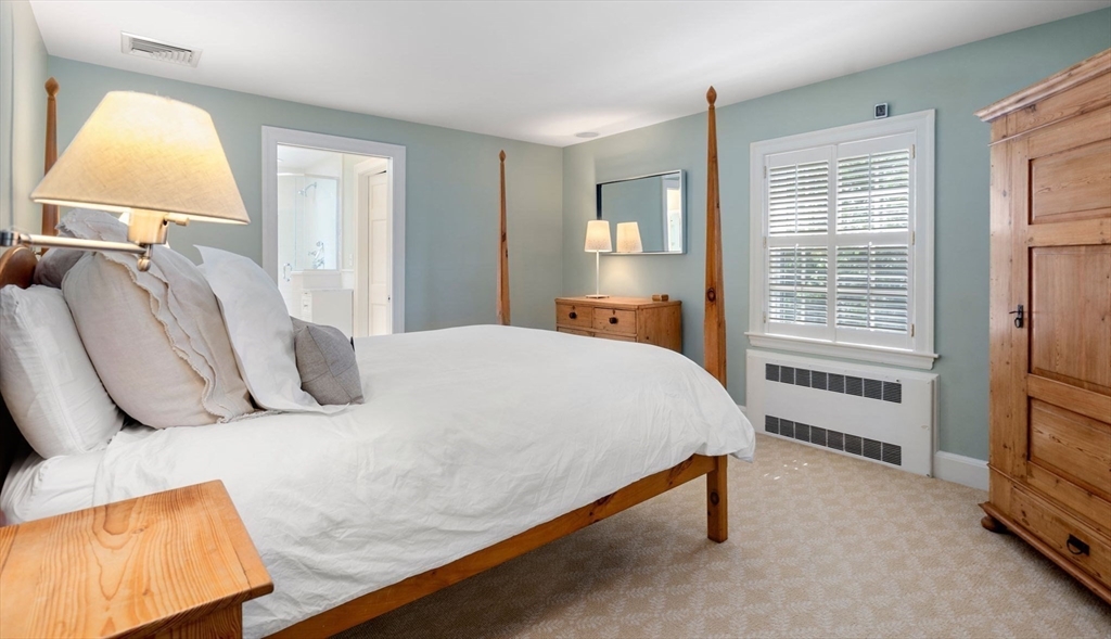 30 Park Avenue Wellesley, MA 02481 - Photo 19 of 36 a bed sitting in a bedroom next to a window