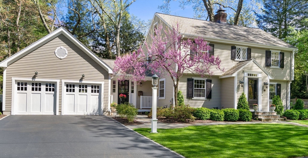 30 Park Avenue Wellesley, MA 02481 - Photo 2 of 36 a front view of a house with a yard and porch