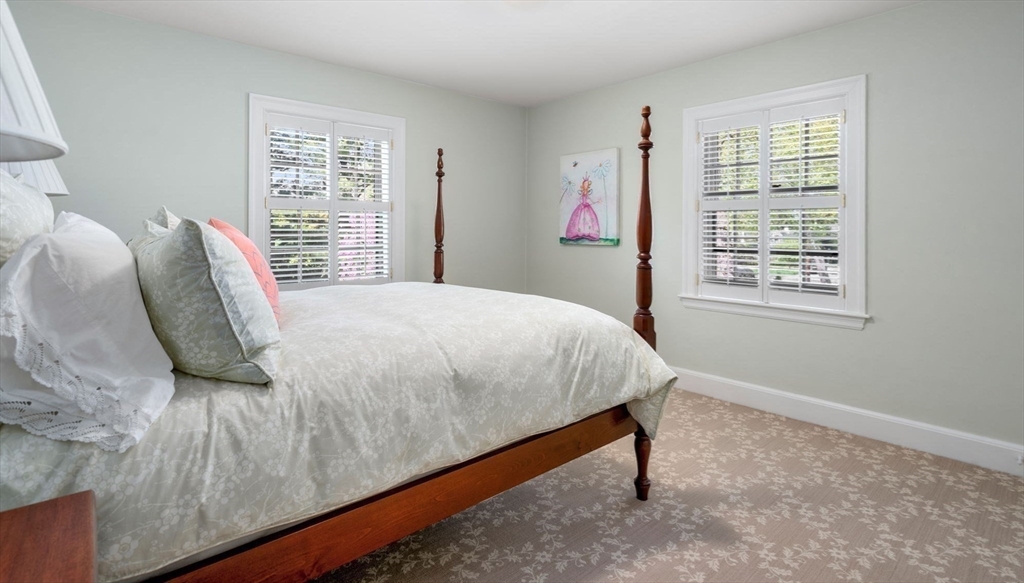 30 Park Avenue Wellesley, MA 02481 - Photo 21 of 36 a bedroom with a bed and a window
