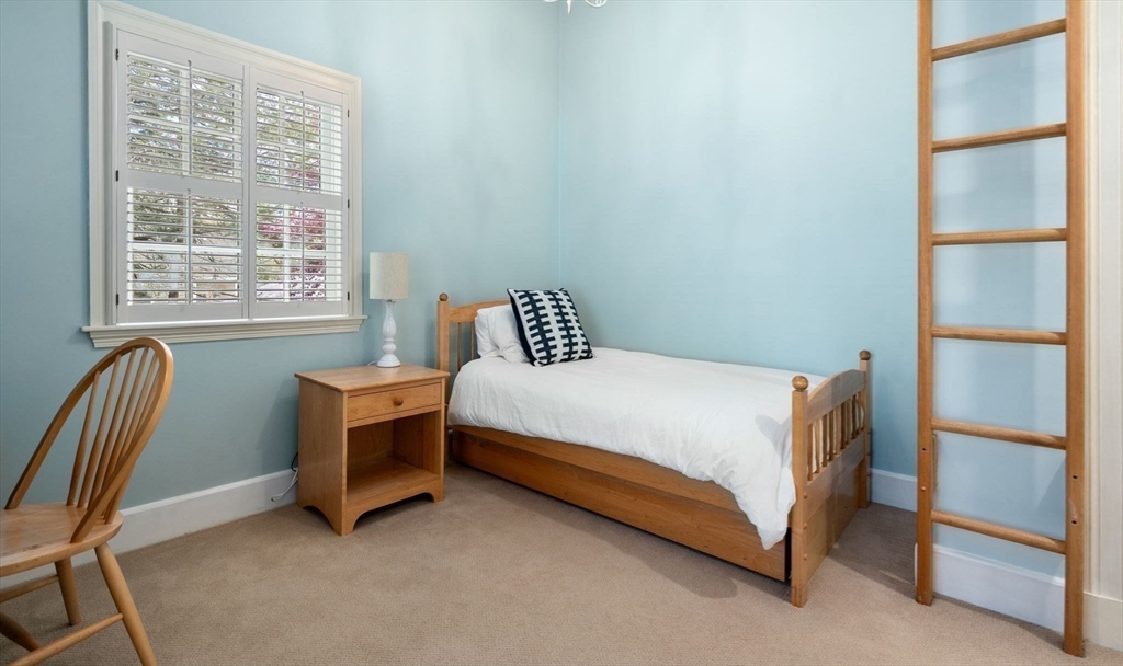 30 Park Avenue Wellesley, MA 02481 - Photo 23 of 36 a bedroom with a bed chair and a window