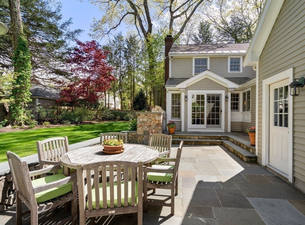 30 Park Avenue Wellesley, MA 02481 - Photo 31 of 36 a view of a patio with a table chairs and a yard