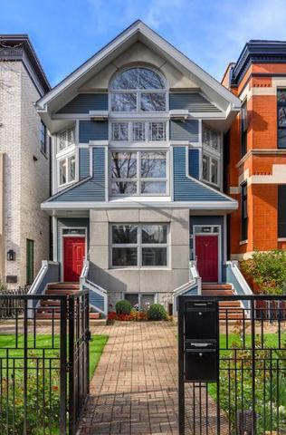 2510 North Burling Street, Unit 1 Chicago, IL 60614 - Photo 1 of 9 a front view of a house with a yard