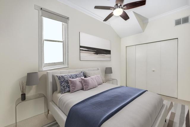 2510 North Burling Street, Unit 1 Chicago, IL 60614 - Photo 7 of 9 a bedroom with a bed and a window