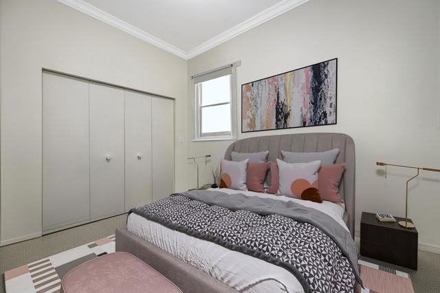 2510 North Burling Street, Unit 1 Chicago, IL 60614 - Photo 9 of 9 a bedroom with a bed and a window
