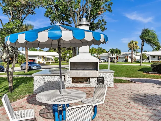 a view of a table and chairs in patio yard