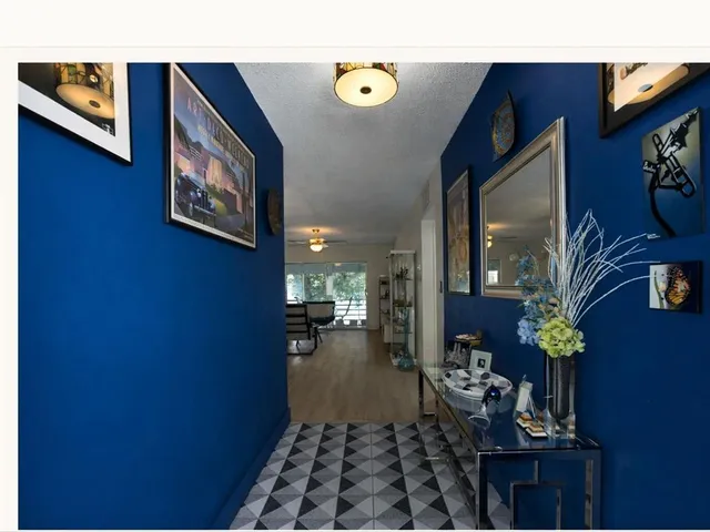 a view of living room with furniture and a window