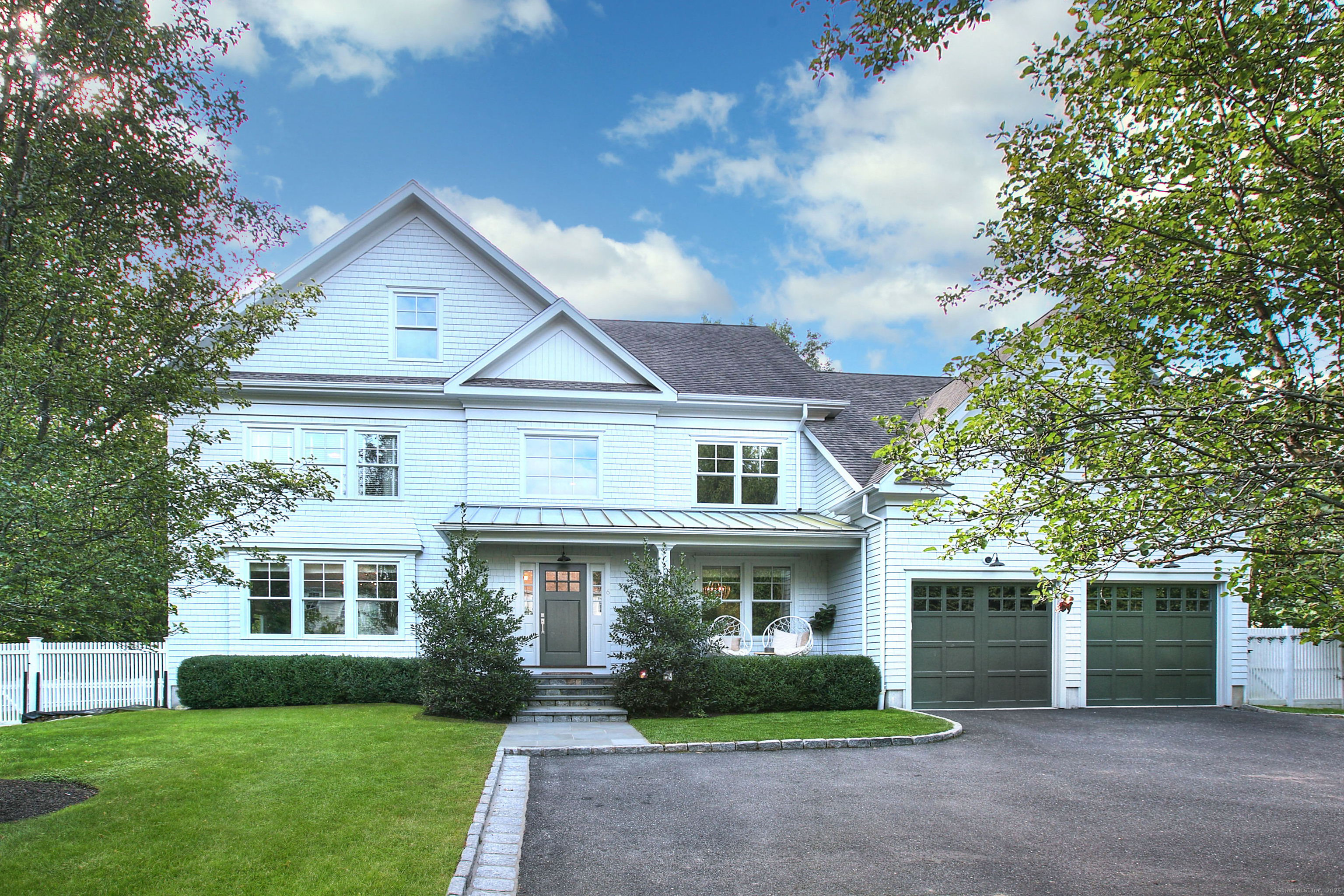 6 Sharp Turn Road Westport, CT 06880 - Photo 1 of 39 a front view of a house with garden