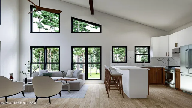 a living room with stainless steel appliances granite countertop furniture a window a kitchen counter space a sink and a window