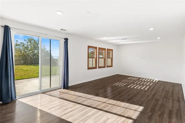 a kitchen with stainless steel appliances a refrigerator stove microwave and cabinets