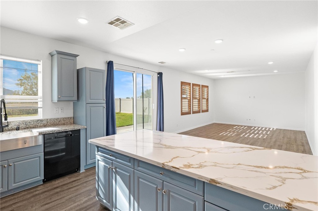 20765 Barn Road Riverside, CA 92507 - Photo 15 of 56 a kitchen with a sink stove and refrigerator