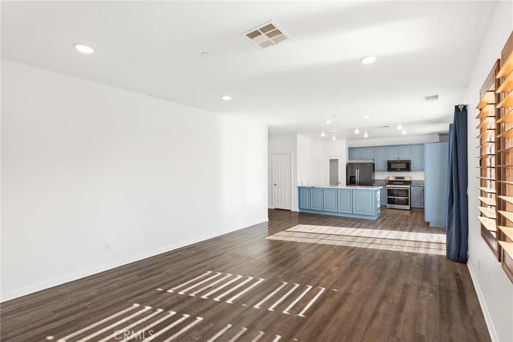 20765 Barn Road Riverside, CA 92507 - Photo 20 of 56 a view of a kitchen with wooden floor and a kitchen
