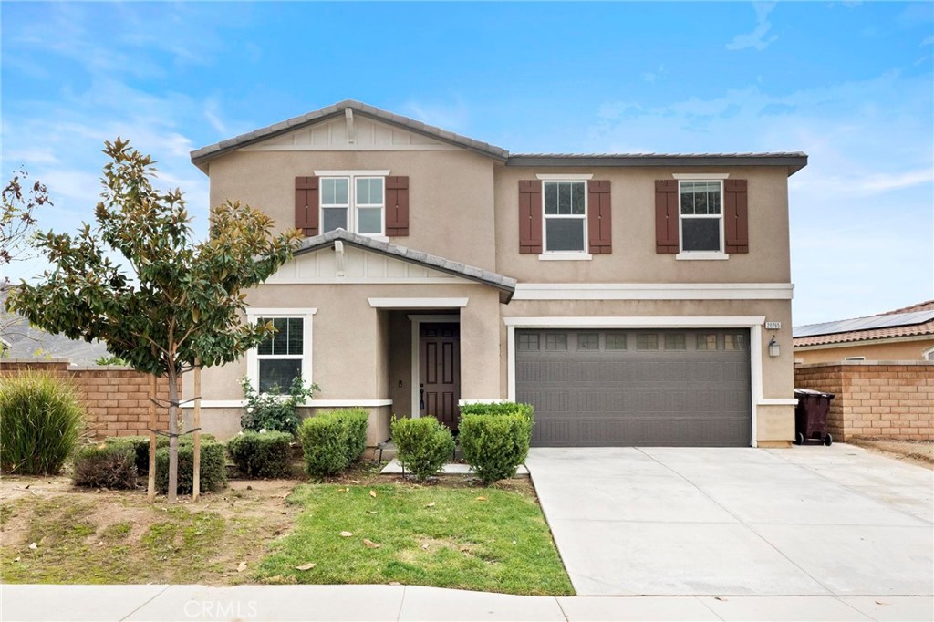 20765 Barn Road Riverside, CA 92507 - Photo 2 of 56 a front view of a house with a yard and garage