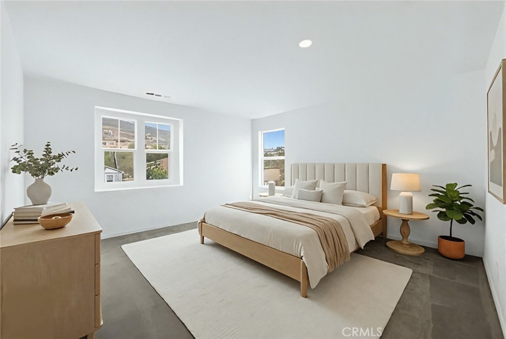 20765 Barn Road Riverside, CA 92507 - Photo 23 of 56 a spacious bedroom with a bed and a window