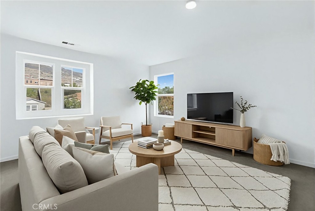 20765 Barn Road Riverside, CA 92507 - Photo 24 of 56 a living room with furniture and a flat screen tv