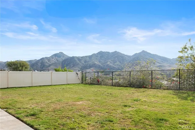 an aerial view of residential house with outdoor space and trees