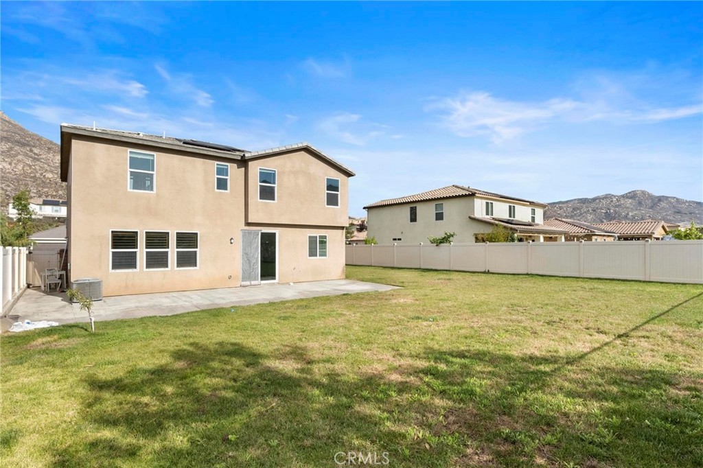 20765 Barn Road Riverside, CA 92507 - Photo 49 of 56 a large building with a big yard and large trees