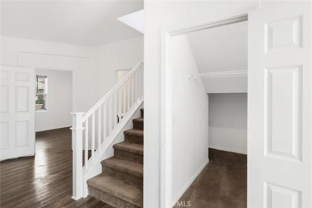 a view of an entryway with wooden floor
