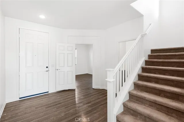 a view of entryway with wooden floor