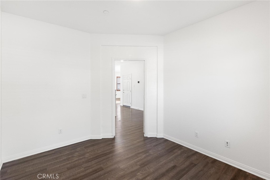 20765 Barn Road Riverside, CA 92507 - Photo 9 of 56 a view of an empty room with wooden floor