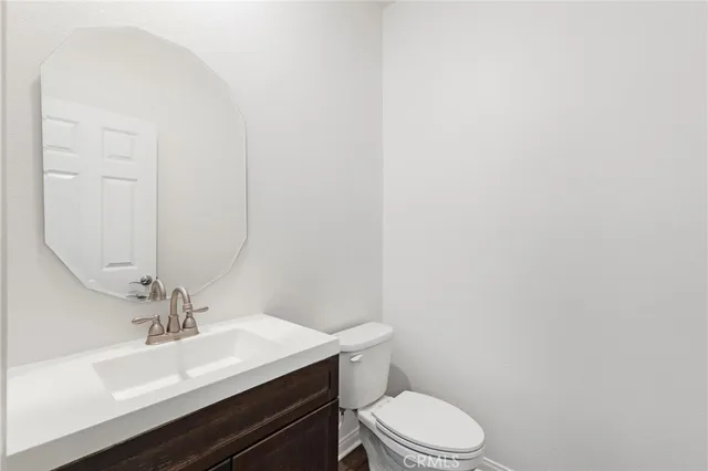 a living room with furniture and large windows