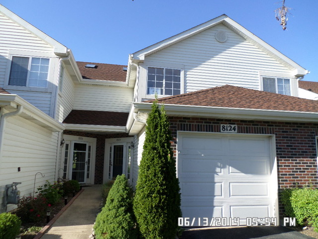 8124 Ripple Ridge Darien, IL 60561 - Photo 1 of 10 a front view of a house with a yard