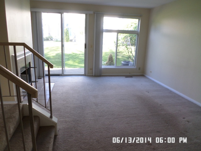 8124 Ripple Ridge Darien, IL 60561 - Photo 3 of 10 a view of an empty room with stairs