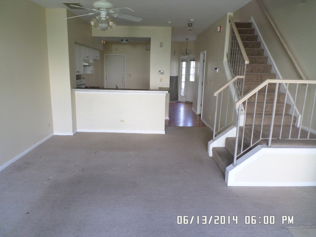8124 Ripple Ridge Darien, IL 60561 - Photo 4 of 10 a view of hall way with staircase