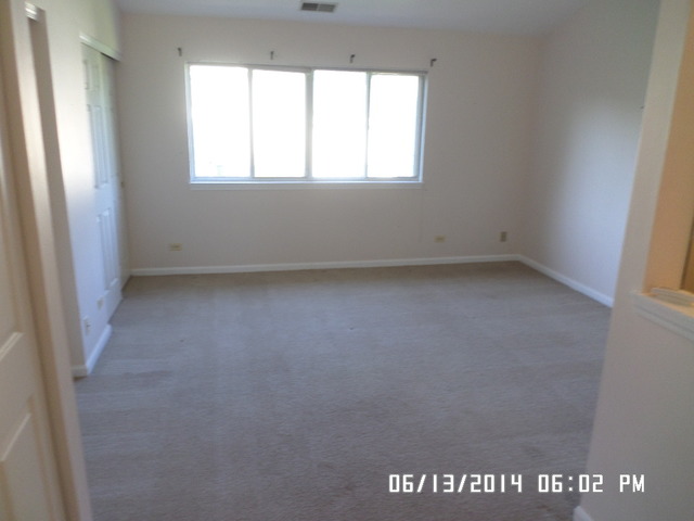 8124 Ripple Ridge Darien, IL 60561 - Photo 5 of 10 an empty room with a window