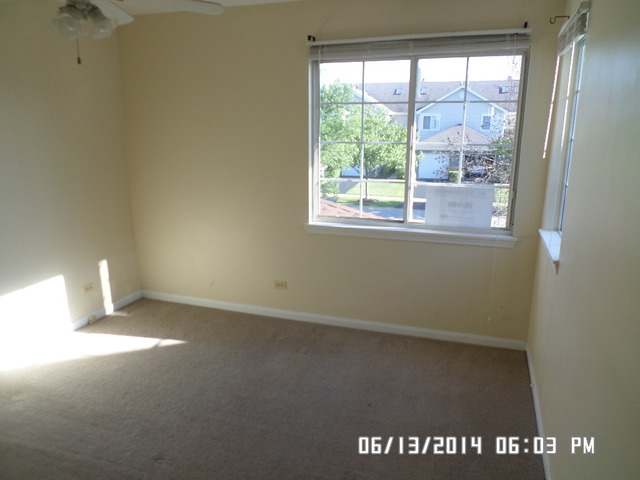 8124 Ripple Ridge Darien, IL 60561 - Photo 8 of 10 an empty room with a window