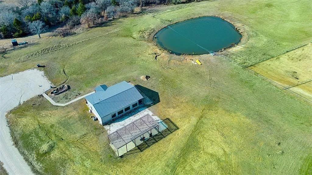 125 Heritage Road Gordonville, TX 76245 - Photo 14 of 40 an aerial view of a swimming pool