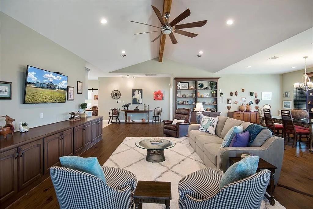 125 Heritage Road Gordonville, TX 76245 - Photo 24 of 40 a living room with furniture a ceiling fan and a rug