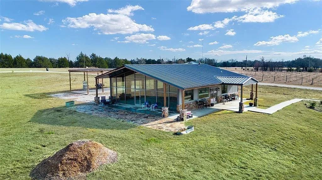 125 Heritage Road Gordonville, TX 76245 - Photo 3 of 40 a view of a house with swimming pool and sitting area