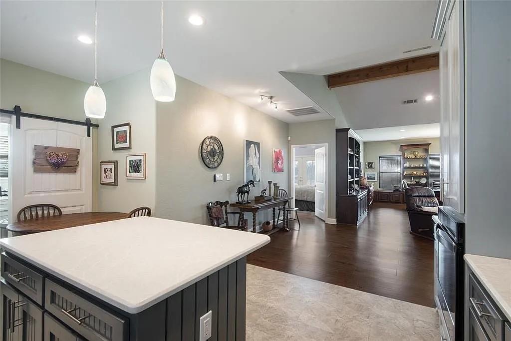 125 Heritage Road Gordonville, TX 76245 - Photo 37 of 40 a view of a dining room with furniture and wooden floor