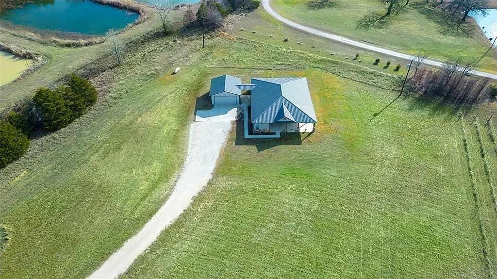 125 Heritage Road Gordonville, TX 76245 - Photo 39 of 40 a view of a house with a yard
