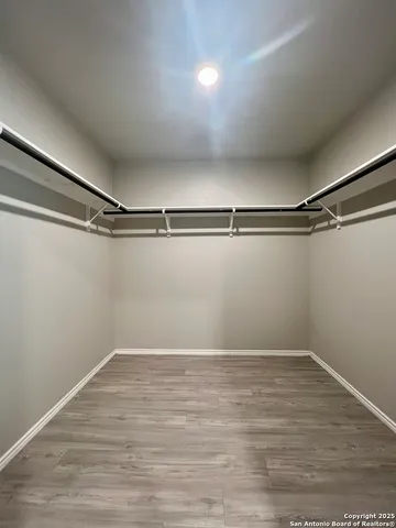 a view of a room with racks on the wall