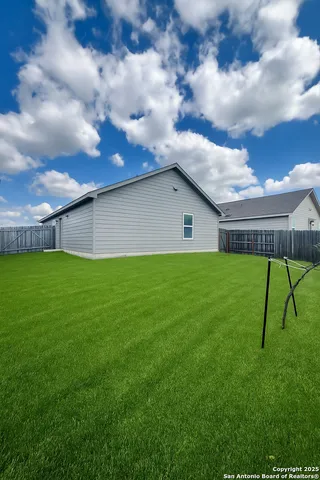 a house view with garden space