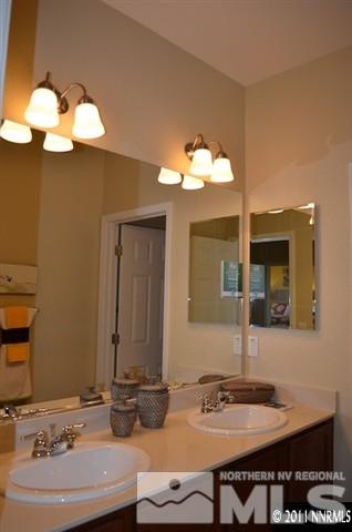 9035 Sydmesa Drive Reno, NV 89523 - Photo 8 of 8 a bathroom with a sink and a mirror