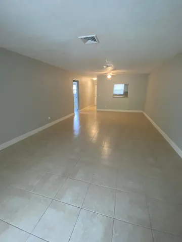 a view of a room has a window