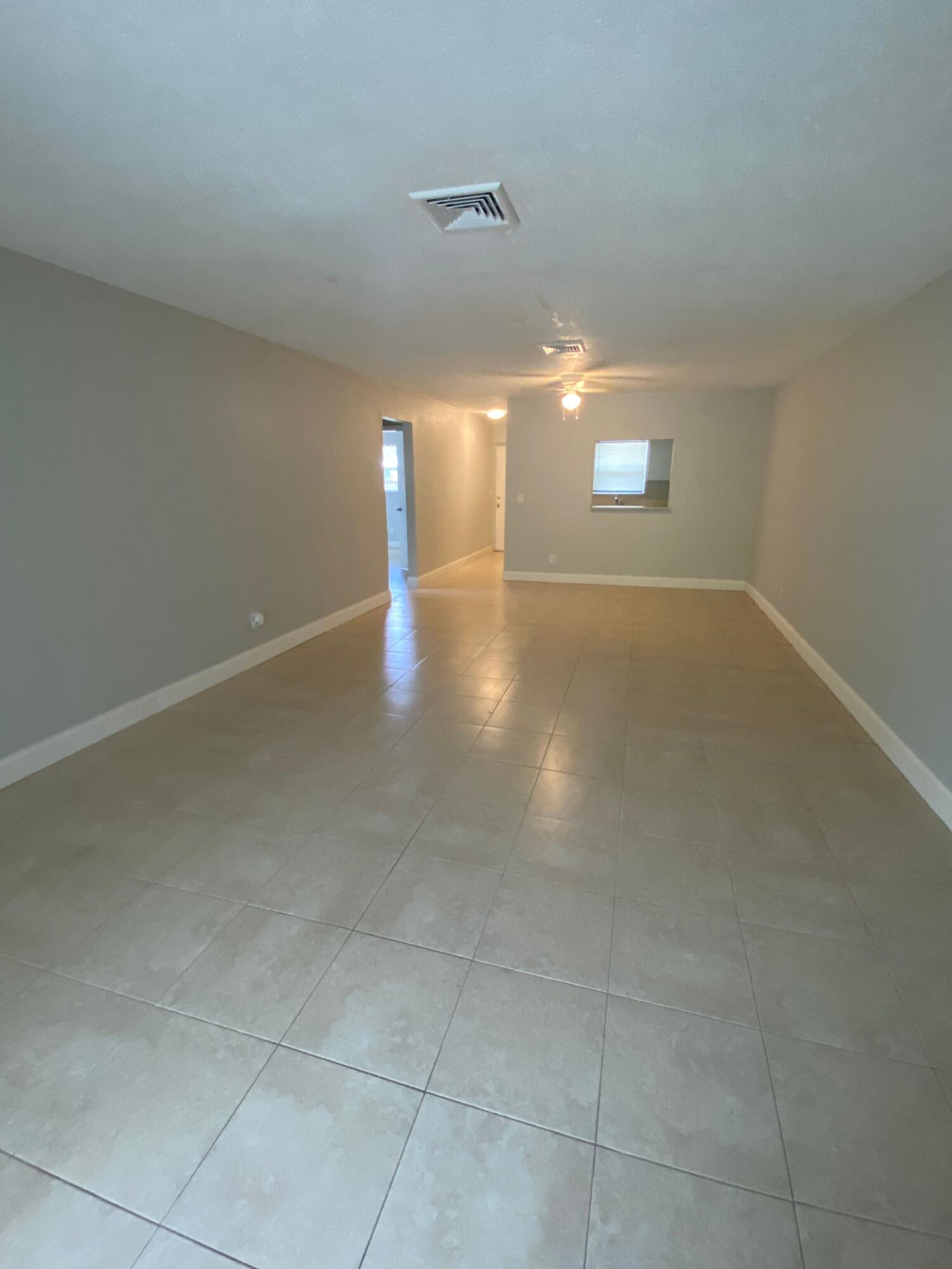 a view of a room has a window