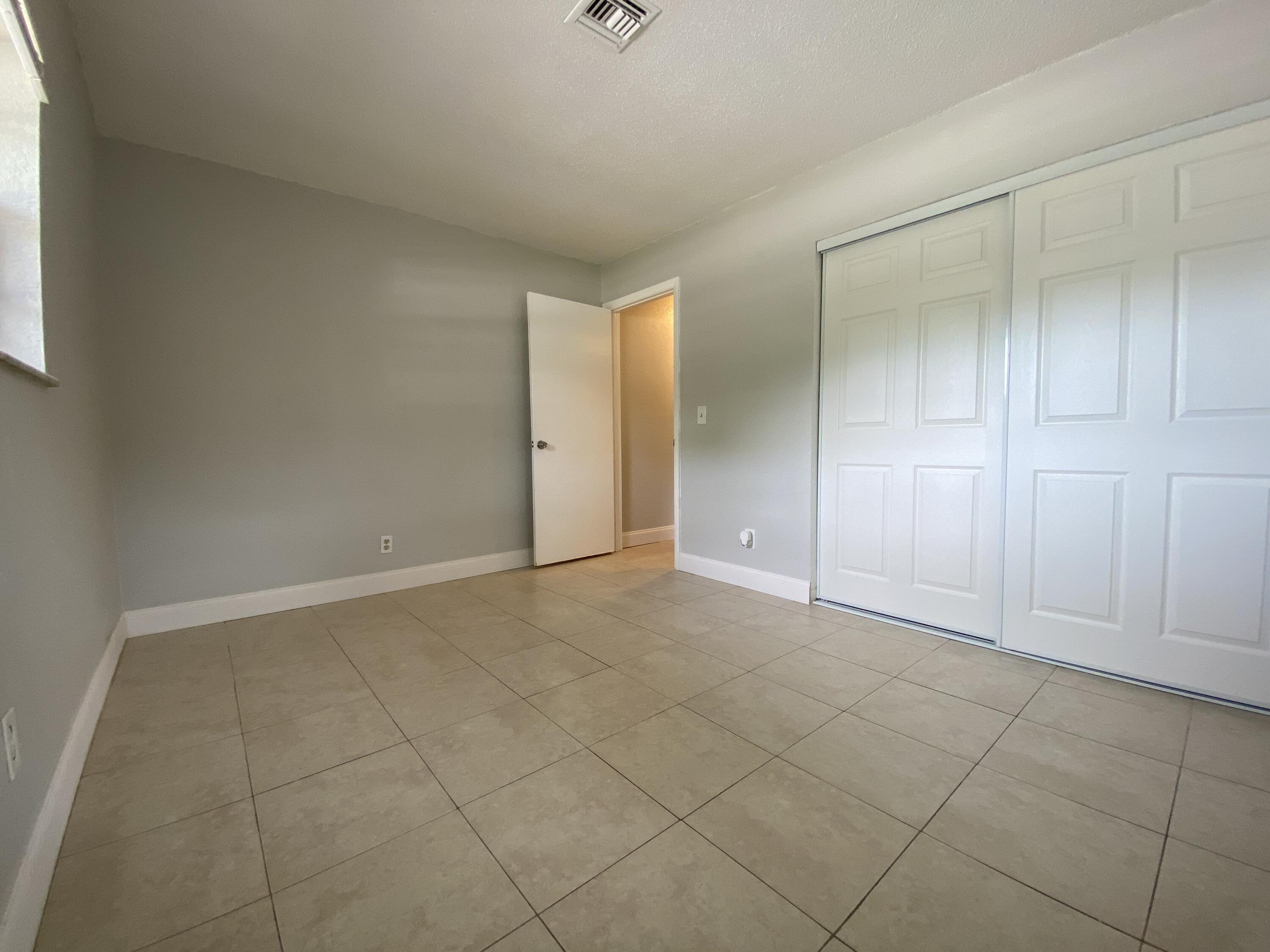 4327 Cocoanut Road West Palm Beach, FL 33406 - Photo 17 of 24 an empty room with a empty space and windows