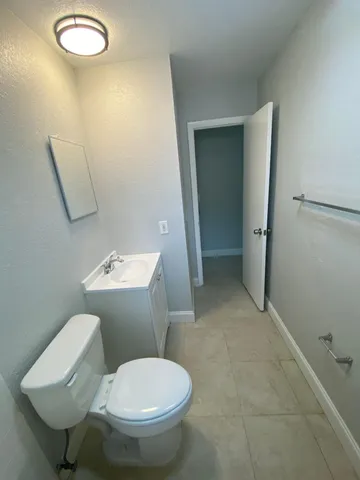 a bathroom with a sink a toilet and bathtub
