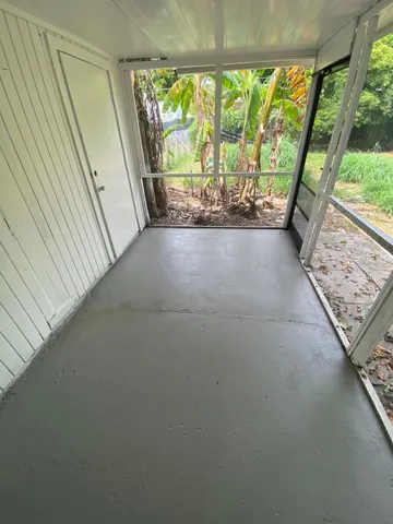 a view of an empty room with a large window
