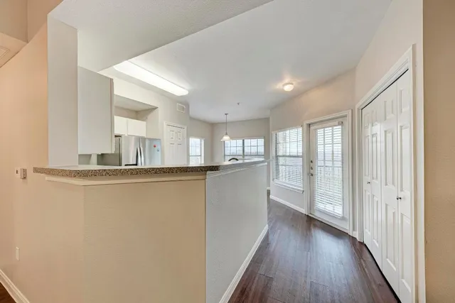a view of a kitchen with wooden floor