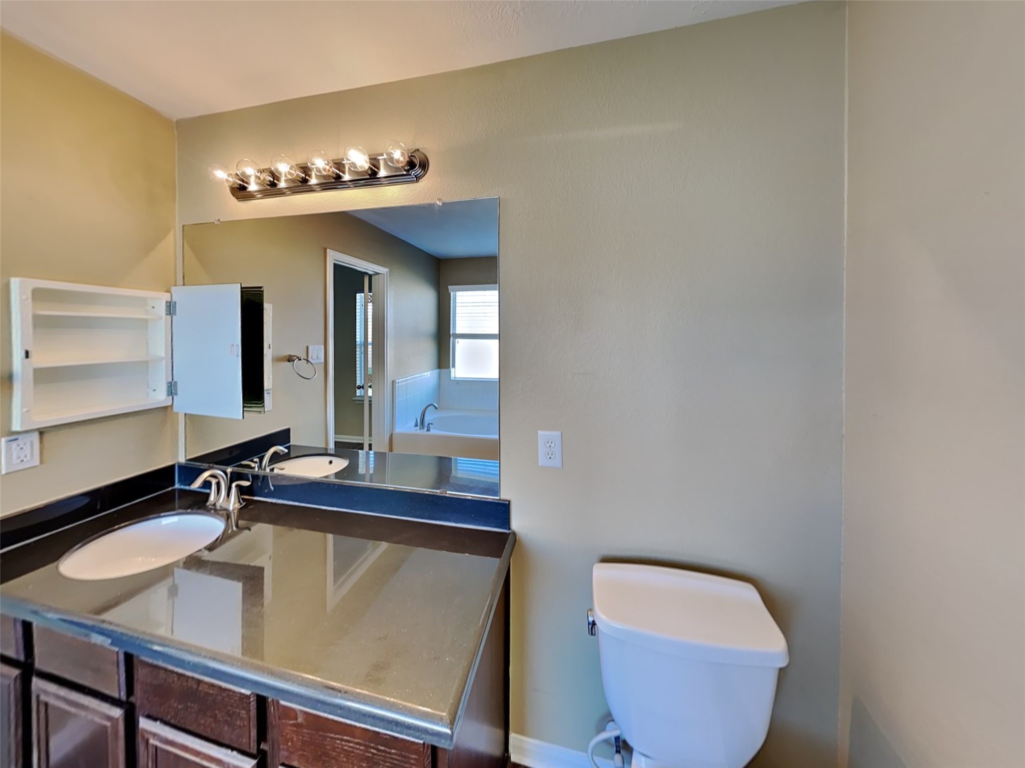 8119 Silent Deep Drive Rosenberg, TX 77469 - Photo 11 of 20 a bathroom with a sink and a mirror