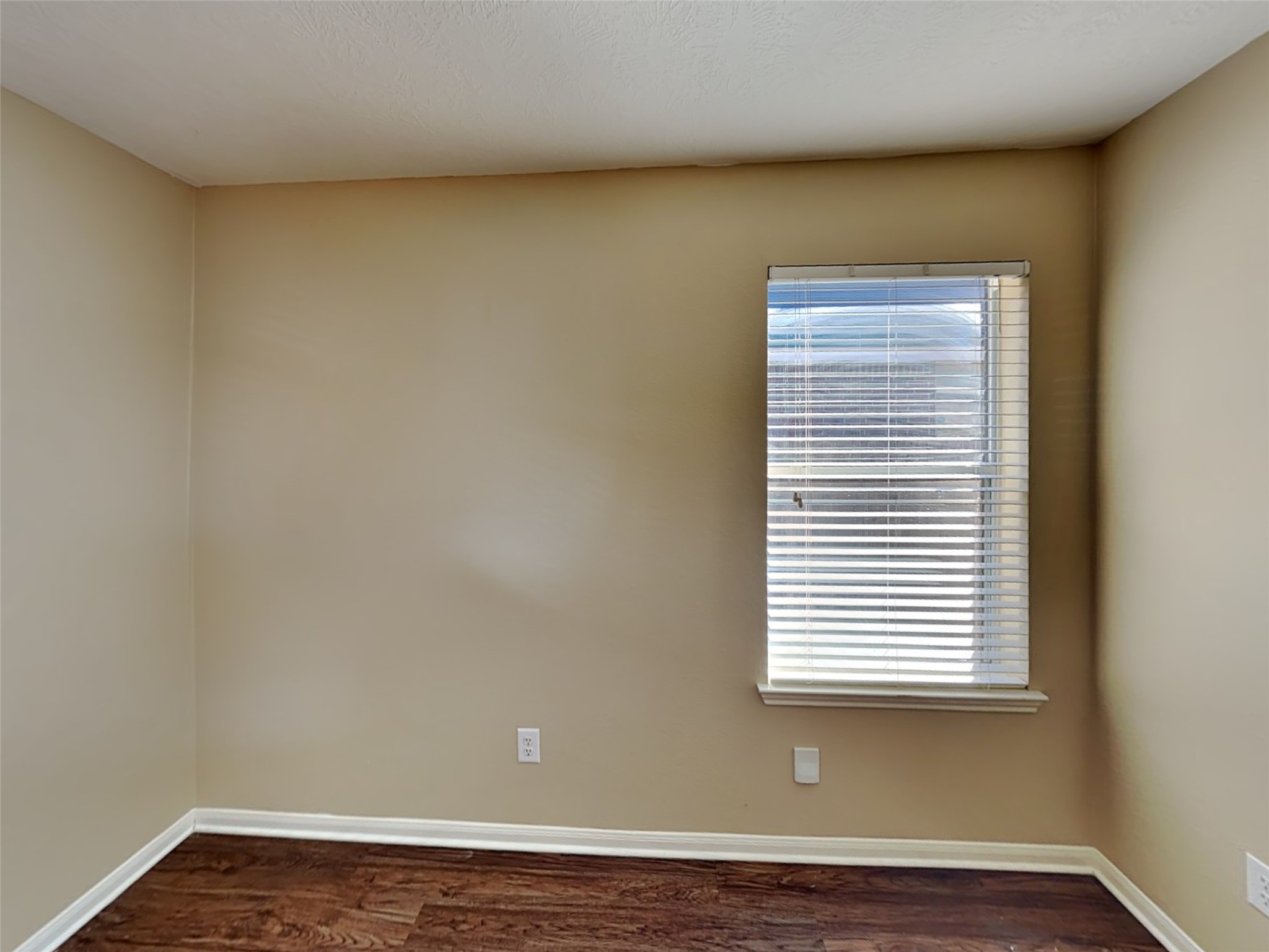 8119 Silent Deep Drive Rosenberg, TX 77469 - Photo 15 of 20 an empty room with wooden floor and a window